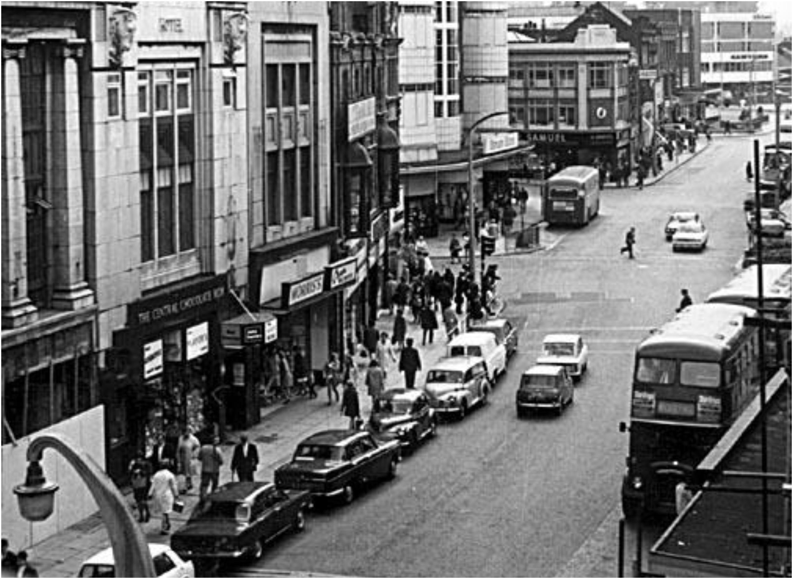 A busy day in the street in the 1960s.