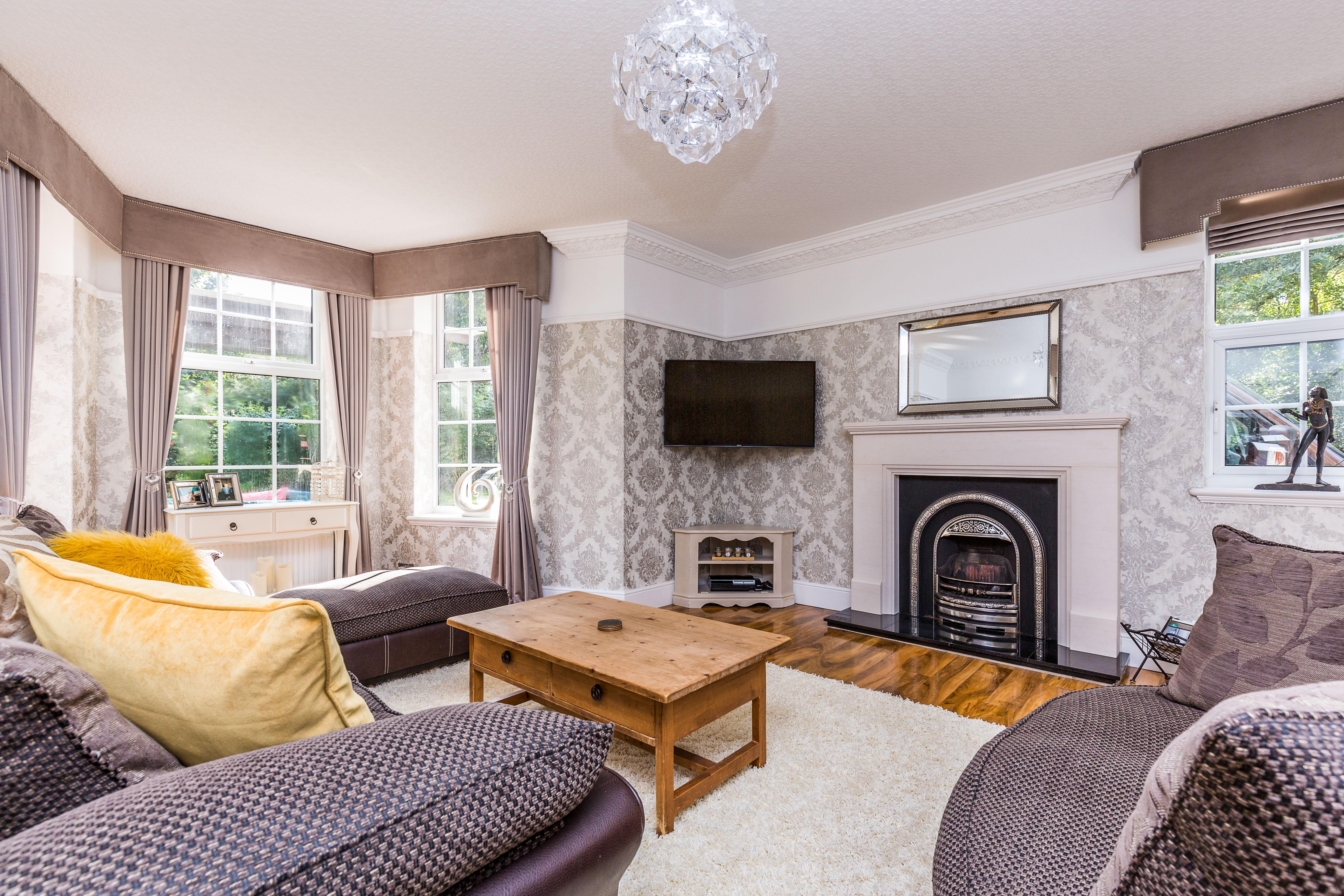 A great space for formal entertaining, this room has three windows.