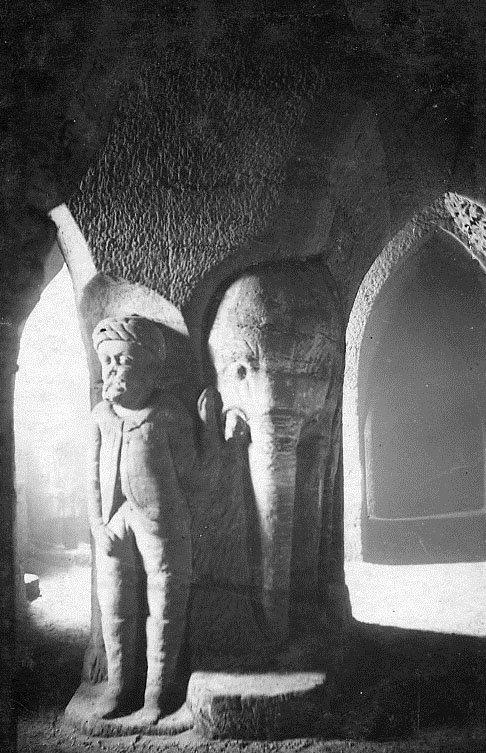 A carving of an elephant and mahout in the Sand House tunnels.