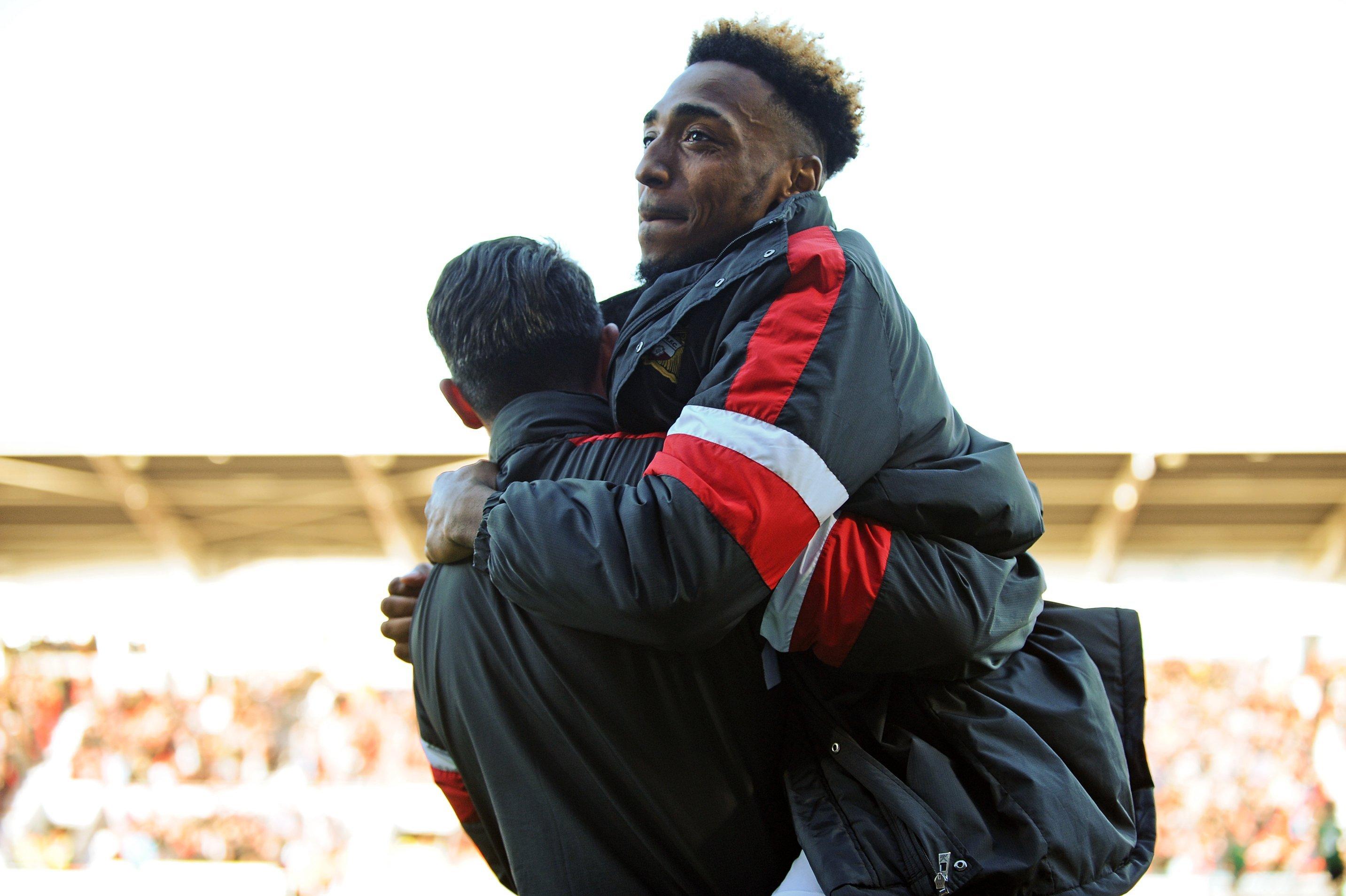 Mallik Wilks celebrate as Rovers secure a play-off spt.
