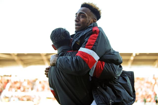 Mallik Wilks celebrate as Rovers secure a play-off spt.