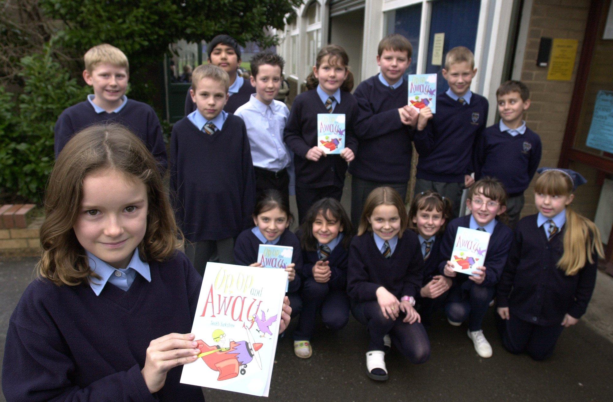 Pupils at St. Peter's  Catholic School, Doncaster, who had poems published in 'Up Up and Away'. Foreground Jasmine Blakemore who was aged ten.