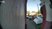 Video grab of the moment a mum was baffled when she looked outside and found a stranger had pitched a tent in her front garden overnight