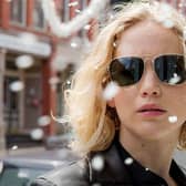 Jennifer Lawrence wearing gold-framed aviators in the movie Joy