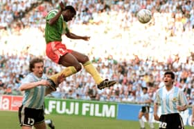 Forward Francois Omam-Biyick from Cameroon scores with a header as Argentinian defenders Nestor Lorenzo (L) and Juan Simon look on during the opening match of Italia 90  (STAFF/AFP via Getty Images)