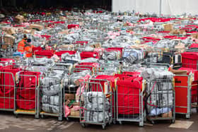 Letter and parcels pile up outside the Royal Mail centre in Bristol. Due to the postal strike along with the busy festive period lots of cages are seen outside the mail centre. Many of these parcels have been left outside for at least 17 hours.