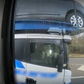 Footage shows the driver using his elbow to control the car transporter (Photo: Highways England) 