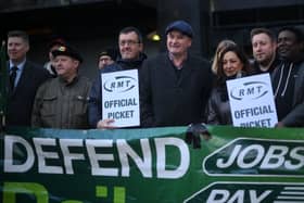 RMT general secretary Mick Lynch (centre) on an RMT picket line during January’s strike (Photo by DANIEL LEAL/AFP via Getty Images)