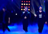 Take That bandmates Mark Owen, Gary Barlow and Howard Donald
