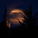 The Flower Moon of May 2020 (which was also a ‘supermoon’) rising above the village of Brixworth (Photo: Clive Mason/Getty Images)