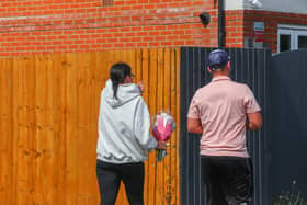 Members of the community lay flowers at the scene of the crash on Turnstone Road, Walsall.