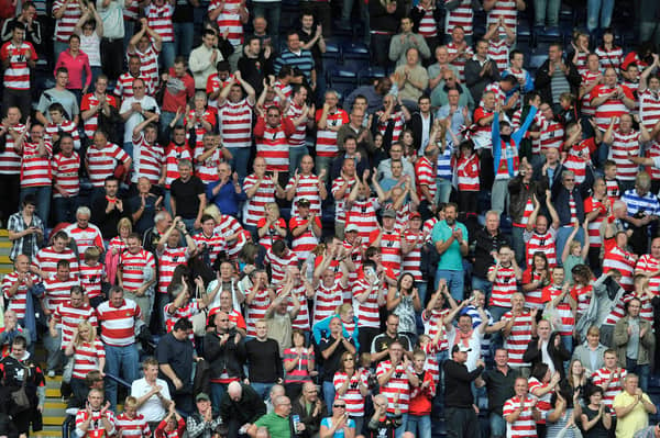 Doncaster Rovers players are reported to have hitched a lift with fans after their matchday bus broke down. File picture, by Steve Parkin, shows Doncaster Rovers fans at a match