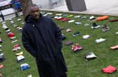 Idris Elba stands in front of an installation of over 200 bundles of clothing representing the lives lost to Knife crime in the UK as he calls on the Government to take immediate action to prevent serious youth violence at Parliament Square on January 08, 2024. (Photo by Jeff Spicer/Getty Images for Don't Stop Your Future)