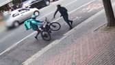 A knife-wielding man attacks a Deliveroo rider.