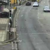 Car crashes through metal barriers and into the front of theatre.