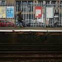 A person walks along a railway platform at Paddock Wood railway station in south east England on April 8, 2024, as train drivers strike over pay. (Photo by BEN STANSALL/AFP via Getty Images)