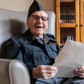 D-Day veteran Bernard Morgan reads historic note revealing end of WW2 in Europe.