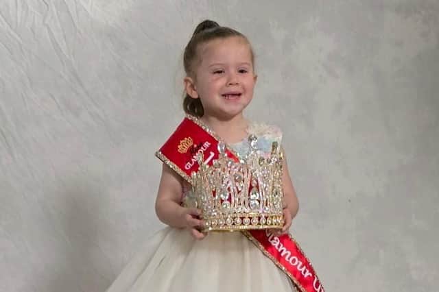 Elouise Smith, holding the crown and brimming with confidence, as Little Miss Glamour UK.