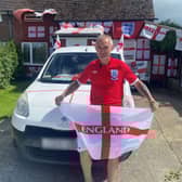 Martin Baker pictured outside his St George's flag covered home. 