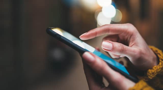 Woman scrolls on a mobile phone.  Photo: A_B_C - stock.adobe.com