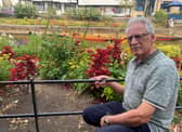 Former councillor Terry Westgate says tourists eager to get the perfect snap have trashed public flowerbeds in an "absolute tragedy' for the city.