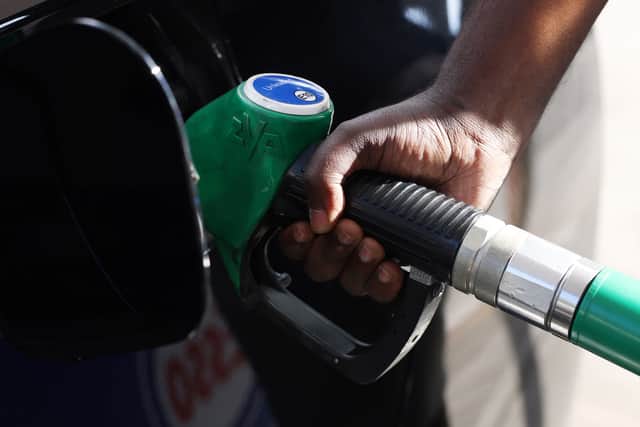 A driver pumps fuel at an Esso Tesco petrol station in 2022 (Photo: Hollie Adams/Getty Images)