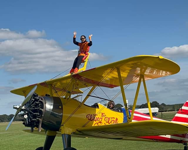 Lucy Sladen doing her aeroplane 'wing walk  for South East Dog Rescue (SEDR)