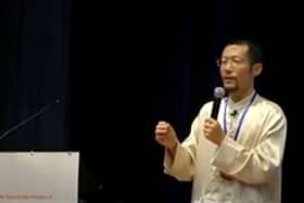 A video grab of Hongchi Xiao conducting a presentation on Paida Lajin therapy.