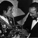 Michael Jackson, left, with Quincy Jones with armful of Grammys at the award show Feb. 28, 1984