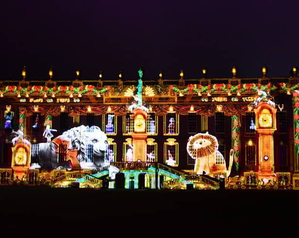 Chatsworth House is now ready and open for the public to enjoy its Christmas theme. Pictured is the front of the house with a light projection of a scene from the story Henry And The Lion's Christmas Feast.