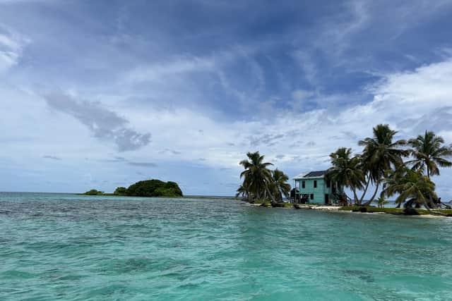 Laughing Bird Caye in Belize is surrounded by beautiful recovering coral reefs