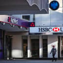People walk pass a branches of HSBC, Natwest and Barclays banks on a pedestrianised shopping street in Bracknell town centre (Photo: ADRIAN DENNIS/AFP via Getty Images)