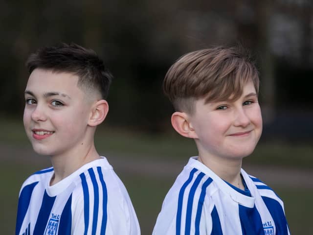 Flo Topham (L) and Camille Porhel, who play for York Railway Institute (YRI) AFC u12s Girls, have launched a campaign defending their right to have short hair, after they were accused of being boys during a game. 