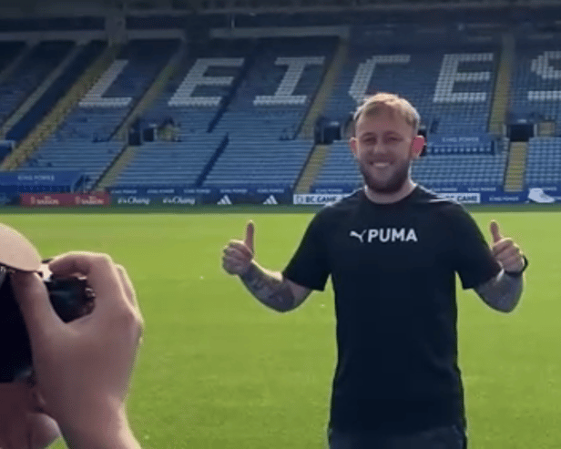 Photo of Matthew getting his photo taken in a Premier League football stadium