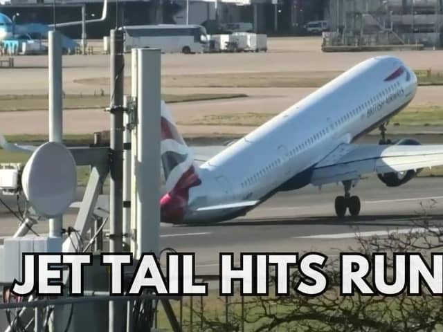 The tail of a plane hitting the ground while trying to land