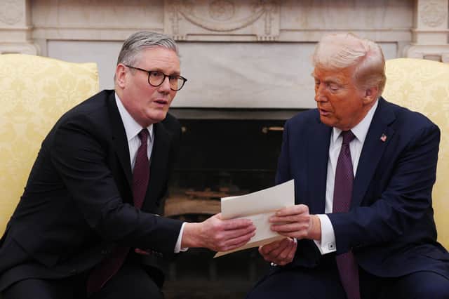 Keir Starmer did his best to flatter Donald Trump, presenting him with an invitation from King Charles to make an 'unprecedented' second state visit, but the diplomatic charm offensive may not be working (Picture: Carl Court/pool)