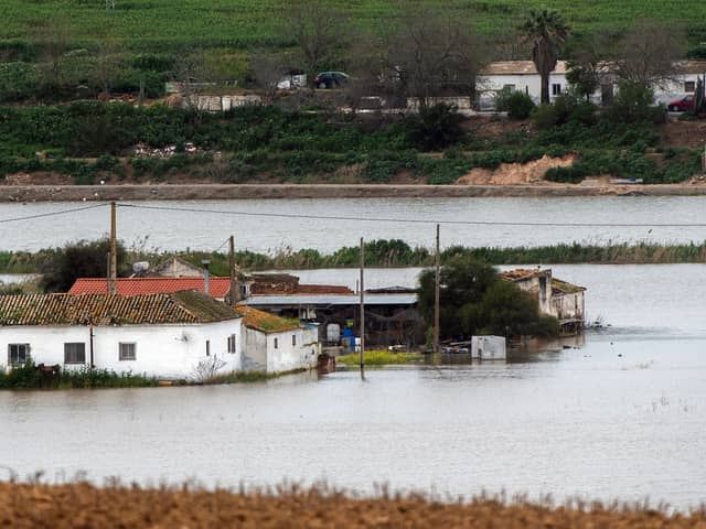 Houses in the middle of a flooded area after Storm Laurence passed through El Palmar de Troya in southern Spain, before Martinho swept in.