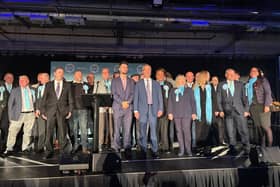 Alexander Jones and Nigel Farage (centre) with Reform UK's slate of council candidates in Doncaster.