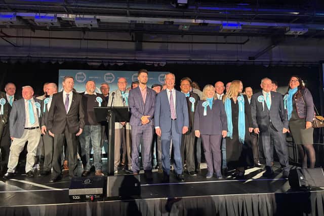 Alexander Jones and Nigel Farage (centre) with Reform UK's slate of council candidates in Doncaster.