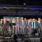 Alexander Jones and Nigel Farage (centre) with Reform UK's slate of council candidates in Doncaster.