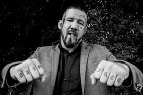 Bare knuckle fighter poses for photograph