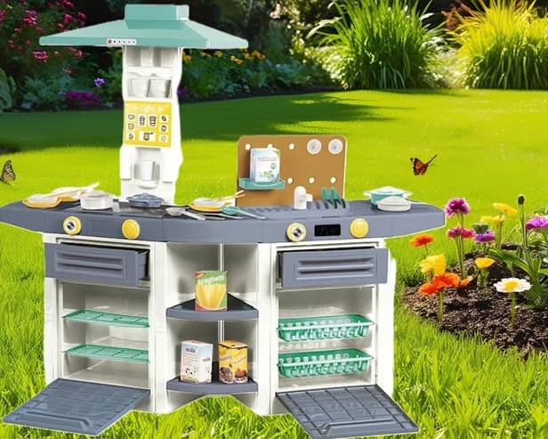 The Dolu play kitchen is durable enough to be used in the garden 