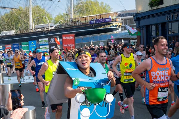Man runs marathon dressed in Domino's Pizza box