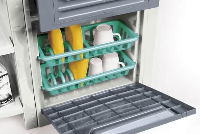 It features a dishwasher and crockery to fit in it