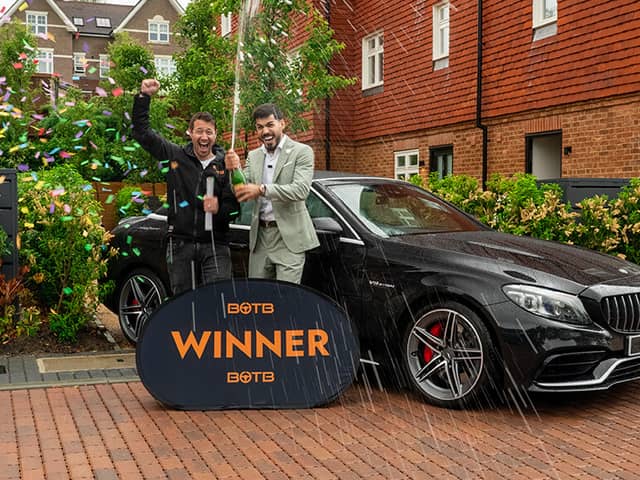 Ali Mohammed (right) popped a bottle of Champagne to toast his huge win