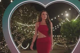 American bombshell Toni entering Love Island villa. 