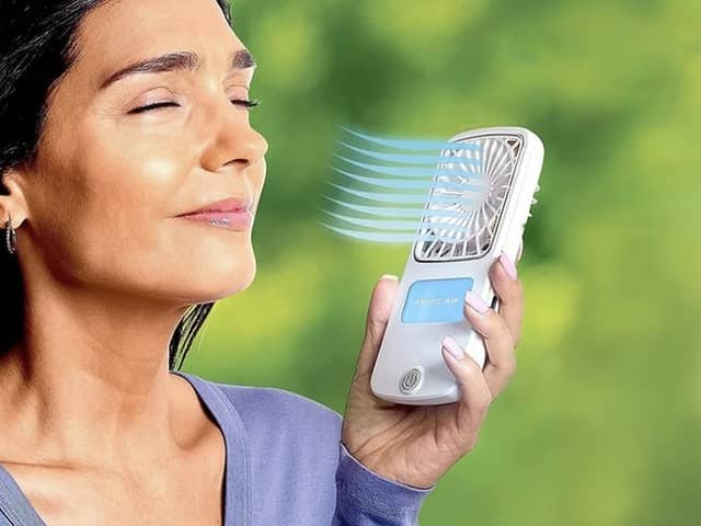 The fan's built-in water tank creates an evaporative effect to blast you with a cold mist