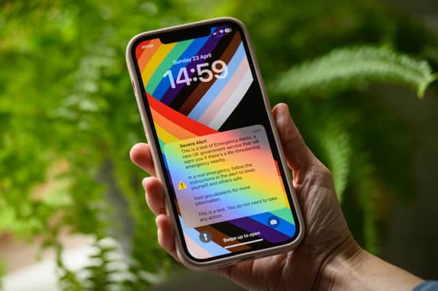A mobile phone receives the nationwide public alert system test signal on April 23, 2023.