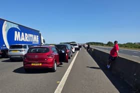 The M18 motorway is "at a standstill" in both directions close to the junction with the M62 after a car reportedly rolled over.
