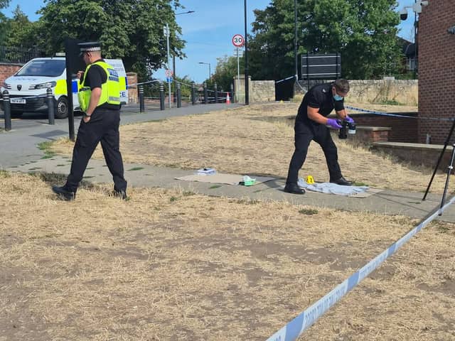 Police at the scene on Town Field on Sunday morning.
